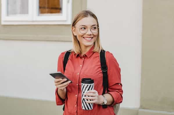Student with mobile phone and a coffee