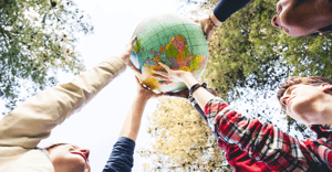 multiple arms outstretched holding a globe over head