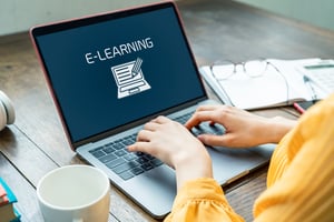 image shows a computer screen with the words e learning written across it