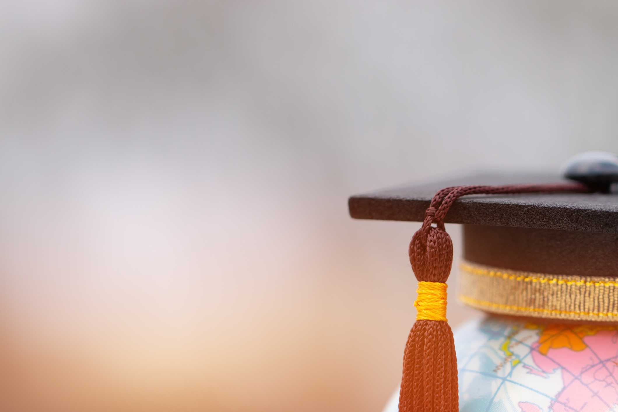Mortarboard on a globe