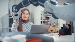 A female student in a robotics lab