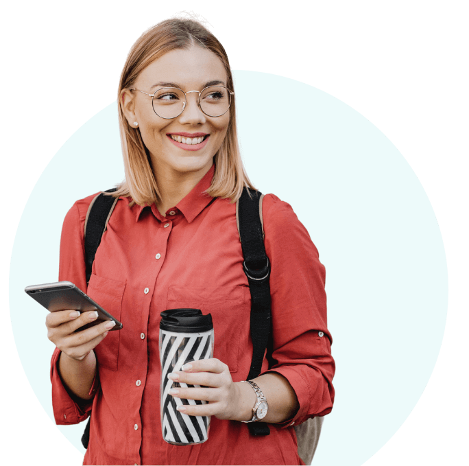female_student_holding_phone_and_coffee_cup