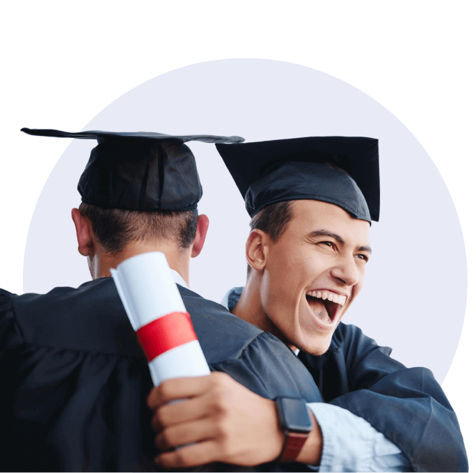 two_male_graduates_celebrating_in_graduation_robes