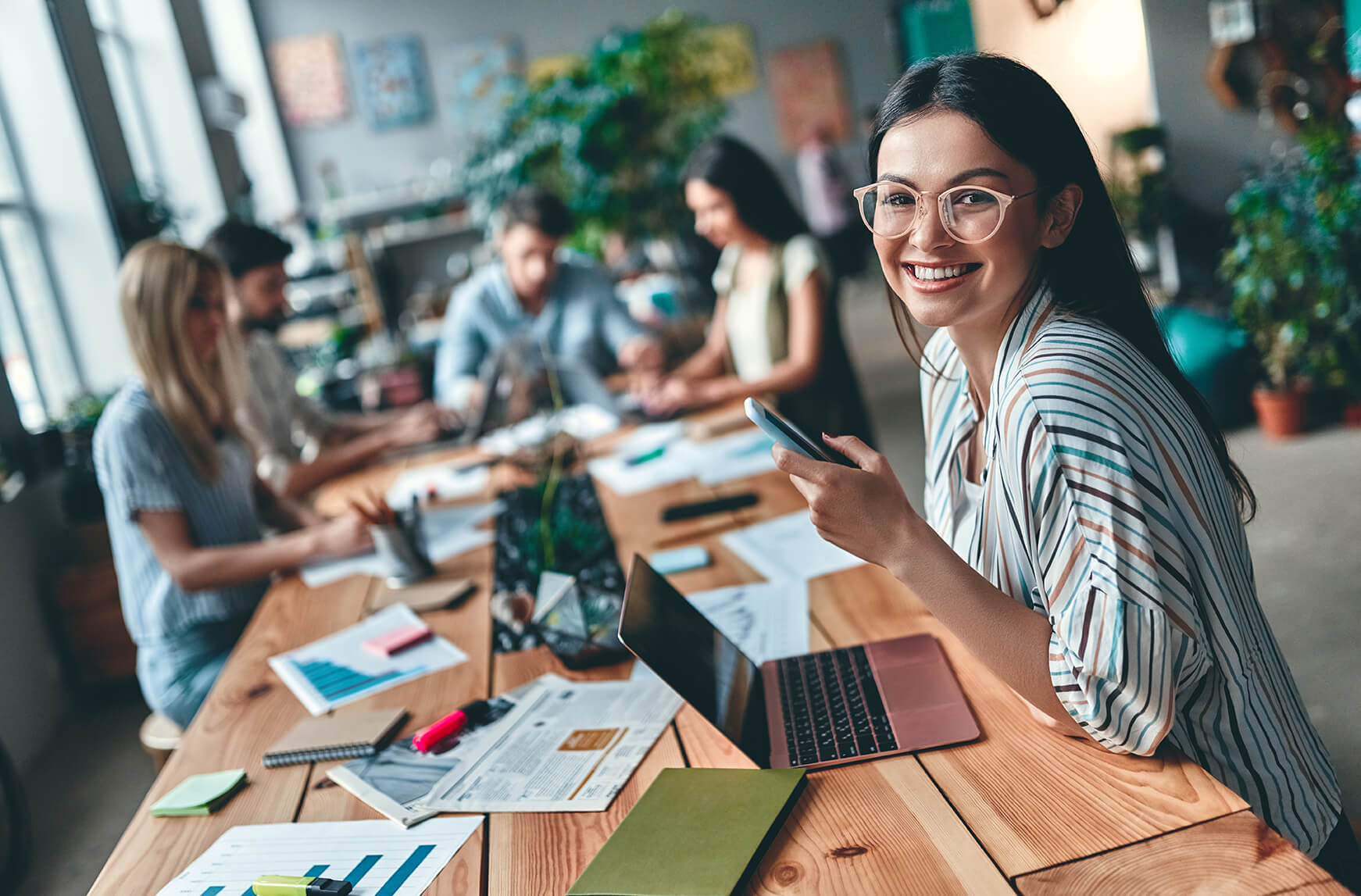 girl in workplace sat at desk