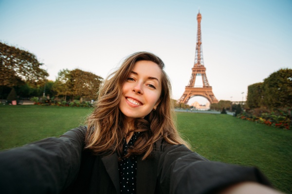 photo of student with Eiffel Tower in background