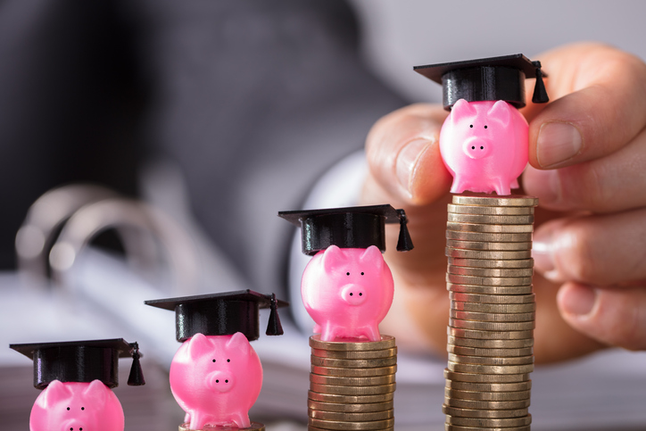 image shows piggy banks with student graduation hats on them 